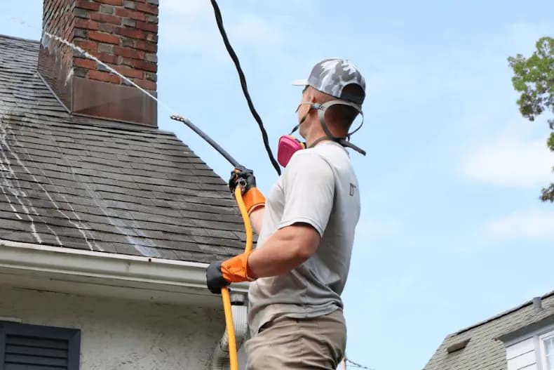 Barberton Power Washing professional performing gentle roof washing service in Barberton