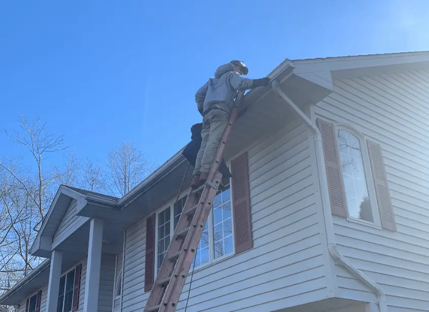 Gutter cleaning and maintenance being performed by Barberton Power Washing in Barberton